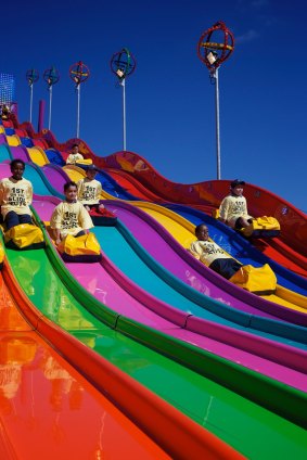 Children ride down the slide at the 2012 Easter Show. 