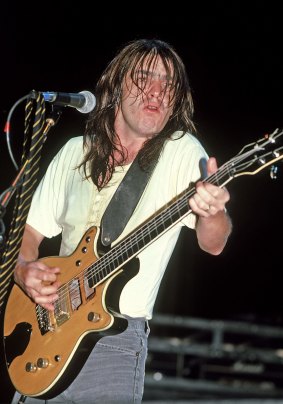 Malcolm Young driving out his powerful beats with AC/DC in 1980.