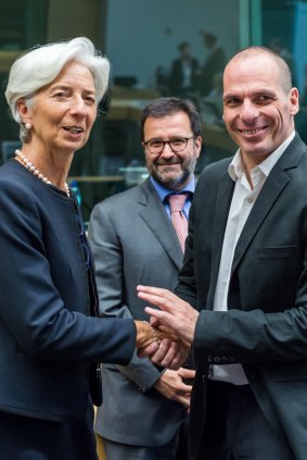 IMF managing director Christine Lagarde, left, greets Greek Finance Minister Yanis Varoufakis on Thursday. 