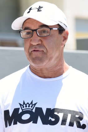 Jeff Fenech reads a statement outside his Five Dock home.