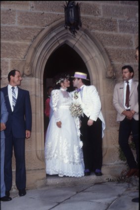 Elton John and Renate Blauel outside the church on their wedding day in 1984.