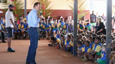 Tony Abbott, pictured addressing schoolchildren during his visit to Bamaga, Cape York, on Wednesday, has repeated that Barack Obama raised the issue of expanded RAAF strikes with him in July.