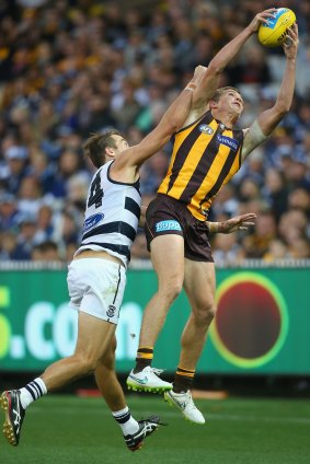 Mine, all mine: Jed Anderson marks in front of Corey Enright of the Cats.