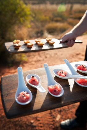 The Sounds of Silence experience starts with sunset drinks in the desert overlooking Uluru and Kata Tjuta, and includes a buffet dinner as well as some post-prandial stargazing.
