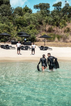 Staff await with Dom Perignon after snorkelling at Lizard Island.