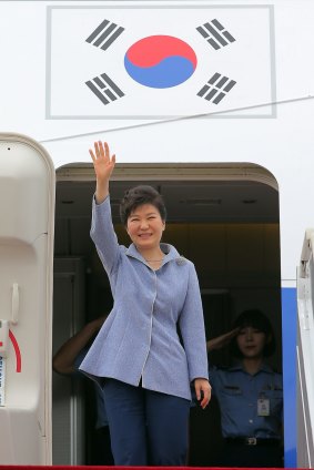 South Korean President Park Geun-hye waves before leaving for China from Seoul Military Airport in Seongnam, South Korea, on Wednesday.