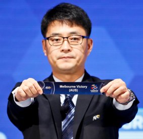 Asian Football Confederation director Shin Mangil draws Melbourne Victory's name.