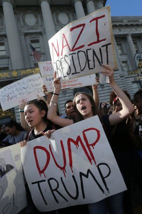 High school students protest  Donald Trump's presidential election victory. His administration 'could sow seeds of distrust and anger and hate that could take generations to fix'.