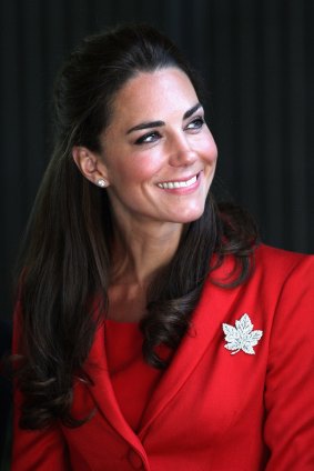 Catherine, Duchess of Cambridge, wearing a maple-leaf badge on her tour of Canada.