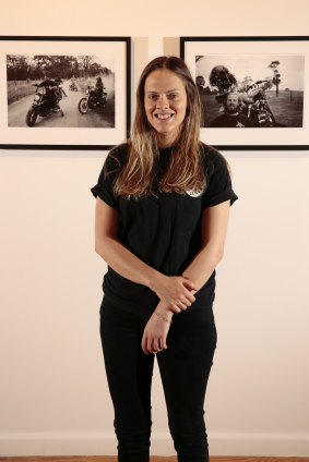 Canberra photographer Stella-Rae Zelnik with her exhibition, Smiles for Miles, at the M16 Artspace. 