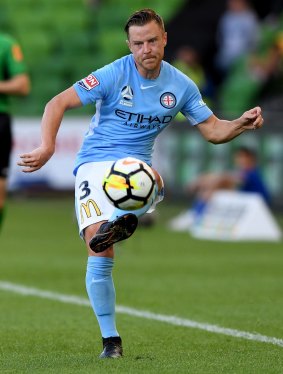 Winging it: Scott Jamieson sends a pass forward for City.