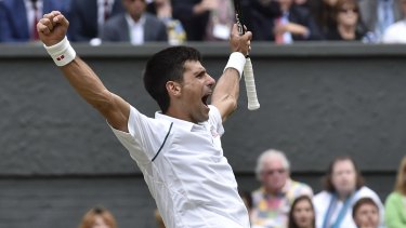 Novak Djokovic celebrates winning the men's singles final against Roger Federer.