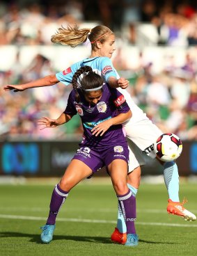 Tussle: Arianna Romero of the Perth Glory and Beverly Yanez of Melbourne City contest for the ball.