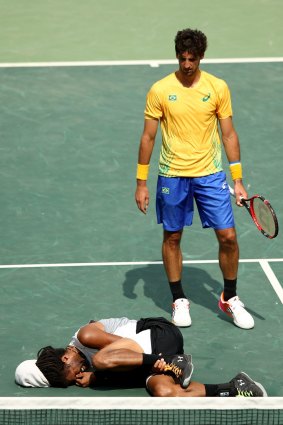 Thomaz Bellucci stands over his stricken opponent, Dustin Brown of Germany.