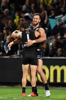 Port Adelaide players had Chinese translations of their names sewn onto the back of their jumpers to mark the club's landmark broadcast deal in China.