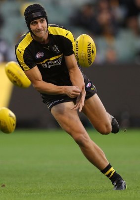 The Tigers' Ben Griffiths warms up before the match against Collingwood in March.