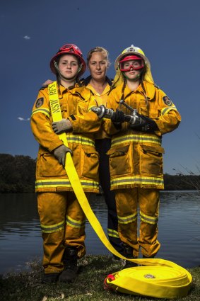 Cassandra Jane Williams (left), Brittany-Jane Williams (right) and mother Victoria Williams of Parkes all serve in their local RFS brigade.
