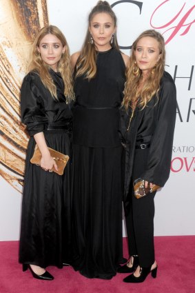 Elizabeth Olsen (centre) with her twin sisters Ashley (left) and Mary-Kate Olsen in 2016.