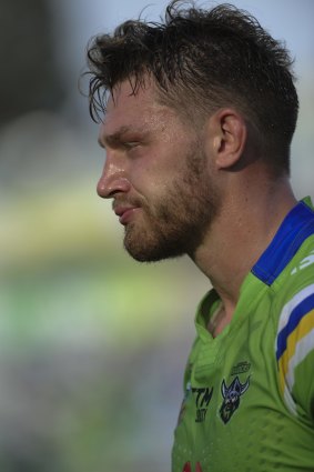 A dissappointed Raiders player Elliott Whitehead walks off the field at the end of the game.