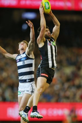Collingwood's Alex Fasolo leaps high to mark against Geelong on Friday.