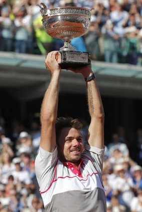 Stan Wawrinka holds the trophy after winning the French Open final against Serbia's Novak Djokovic on Sunday.