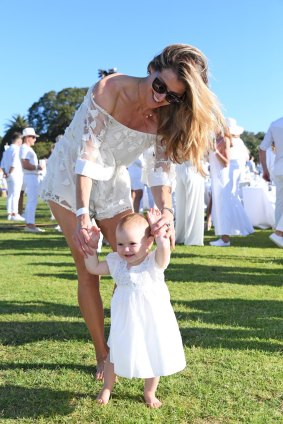 Laura Csortan and her daughter, Layla Rose, 1, at Diner en Blanc in Sydney's Centennial Park.