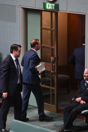 Tony Abbott and Michael Sukkar leave the chamber on Thursday before the final vote.