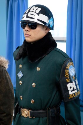 A South Korean soldier stands guard in a Joint Security Area conference room.