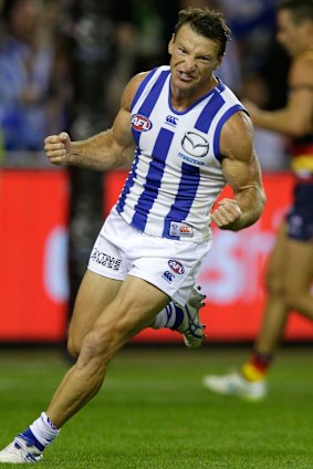 Evergreen: The Roos' Brent Harvey celebrates a goal during the round one match against Adelaide.