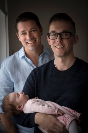 Gay couple, Andy Brough and Simon Curtis with their 7 weeks old baby, Adaline. 