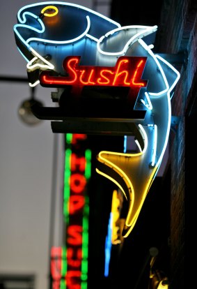 A neon sushi sign in Little Tokyo, Los Angeles.