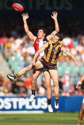 Paddy McCartin of the Saints and Taylor Duryea of the Hawks compete for the ball in the air.