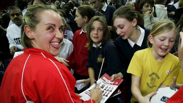 Centre of attention: Tracey Neville signs autographs for fans during her England playing days in 2004.