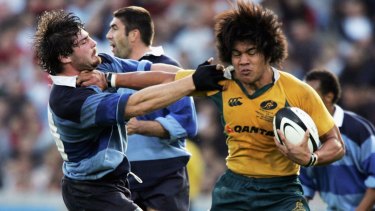 Flashback: Digby Ioane holds off Yannick Forestier during the French Barbarians v Australia A match at Chaban-Delmas Stadium in 2005.