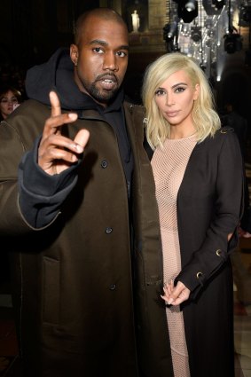 Kanye West and Kim Kardashian attend the Lanvin show as part of the Paris Fashion Week earlier this year.