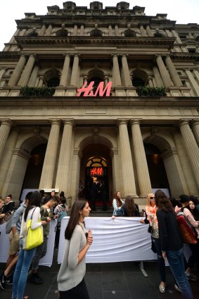Shoppers line up outside a H&M  store in Melbourne.