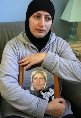 Killed: Salwa Haydar holding a picture of her mother in 2007.