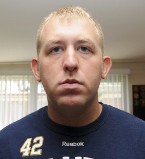 Officer Darren Wilson in an undated photo released by the St Louis County Prosecutor's Office.
