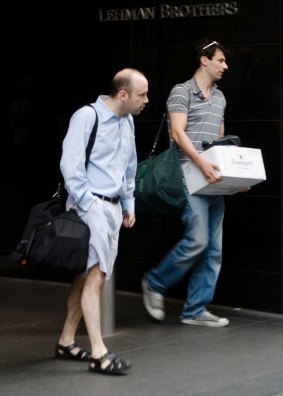 Bankers leaving Lehman's headquarters in New York on September 14, 2008. The bank filed for bankruptcy a day later.