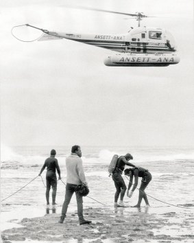 Navy skin divers prepare to enter the ocean at Cheviot Beach to search for Harold Holt in December, 1967.