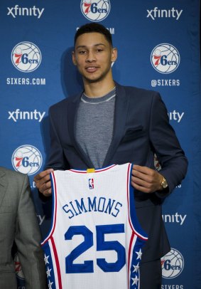 New colours: Philadelphia 76ers draft pick Ben Simmons poses for photographs during a news conference.