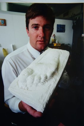 Detective Constable Ashley Rushton holds the plaster cast of what is believed to be the killer's footprint.