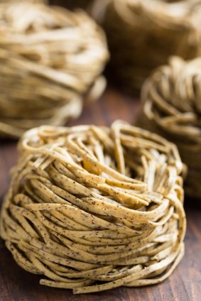 Tajarin or Tagliolini, made with fresh eggs and buckwheat flour, a specialty pasta from Piedmont.
