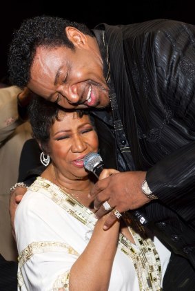 Aretha Franklin sings with Dennis Edwards at her 69th birthday party in New York, 2011.
