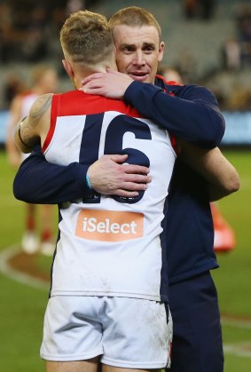 Good spirits: Demons coach Simon Goodwin congratulates Dean Kent after the win.