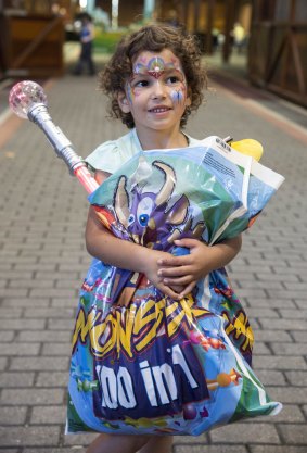 Kyleah Tangye holds onto a Monsters showbag. 
