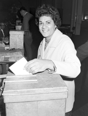 An Indigenous woman casts her vote during the 1967 referendum at polling booth at Sydney Town Hall. 