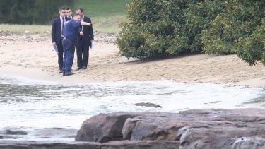 Police set up a crime scene after a woman's body was found in the water near Cabarita Wharf.