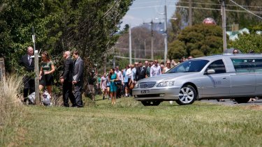 The funeral procession outside the gates of Karen Chetcuti's home.