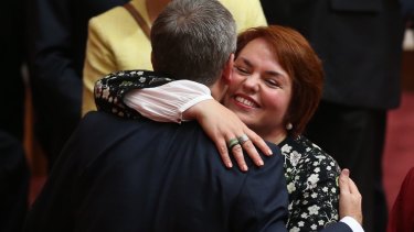 Senator Kimberley Kitching is embraced by Opposition Leader Bill Shorten after her first speech in the Senate last year.